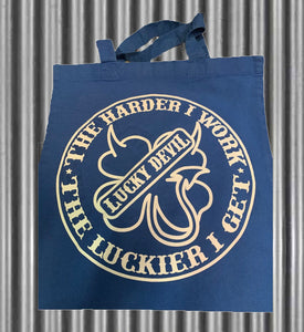 Lucky Devil "The Harder I Work" Tote. Blue Canvas 12"x12"